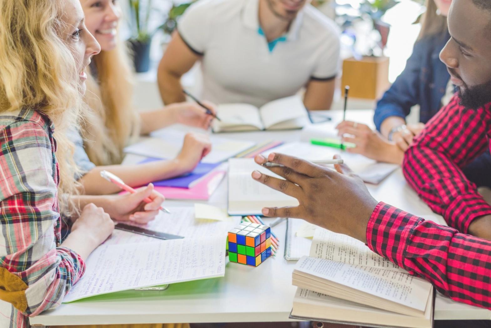 Business team reviewing automated financial reports on shared dashboard display